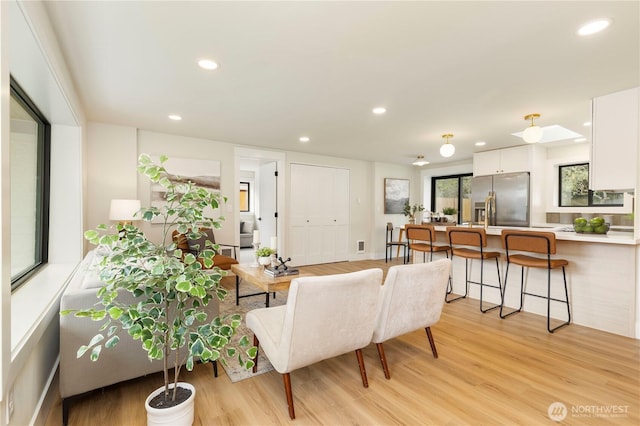 living area featuring recessed lighting and light wood-type flooring