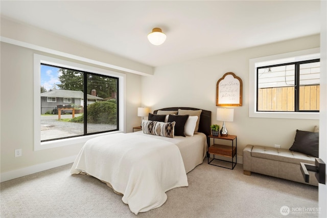 carpeted bedroom with baseboards