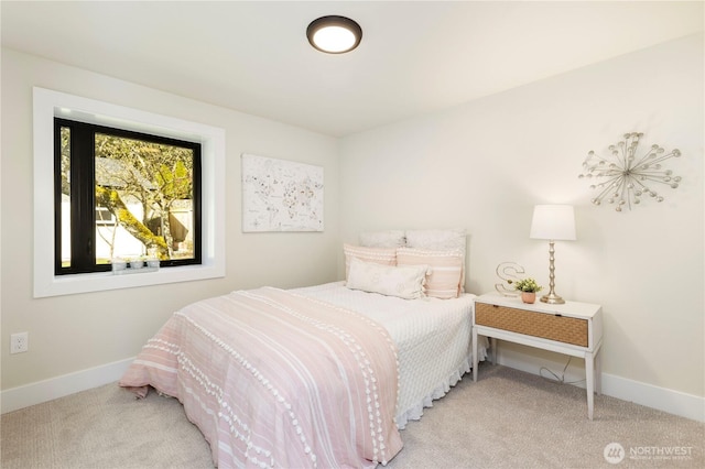bedroom featuring carpet flooring and baseboards