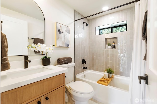 full bath featuring toilet, shower / bath combo, and vanity