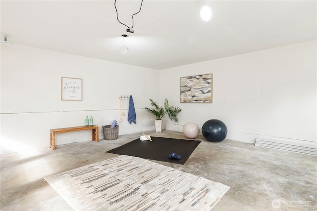 workout area with baseboard heating