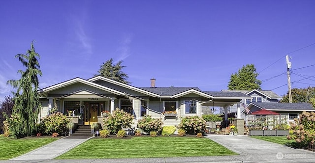 1305 10th St, Everett, WA 98201 - view of front of property with driveway, a front yard, and a chimney
