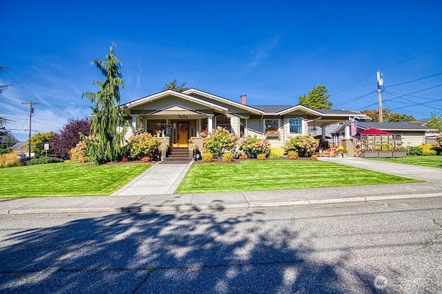1305 10th St, Everett, WA 98201 - view of front of property featuring a front lawn, concrete driveway, a porch, and a carport