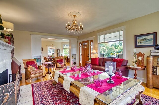 1305 10th St, Everett, WA 98201 - living area with a chandelier, healthy amount of natural light, and a brick fireplace