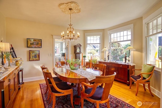 1305 10th St, Everett, WA 98201 - dining space featuring light wood-style flooring and a chandelier