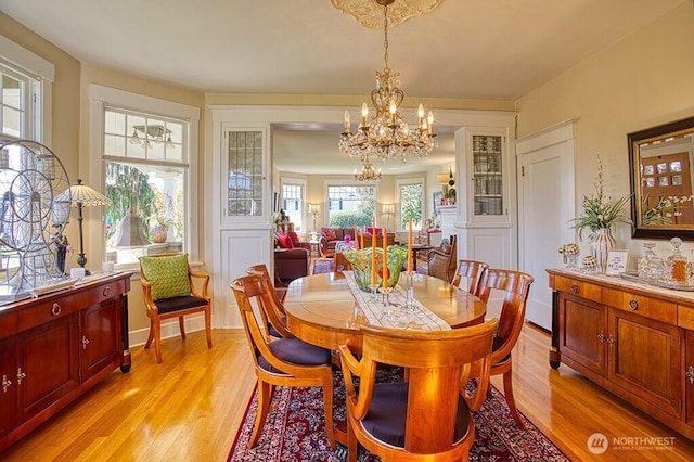 1305 10th St, Everett, WA 98201 - dining room featuring a chandelier and light wood-style flooring