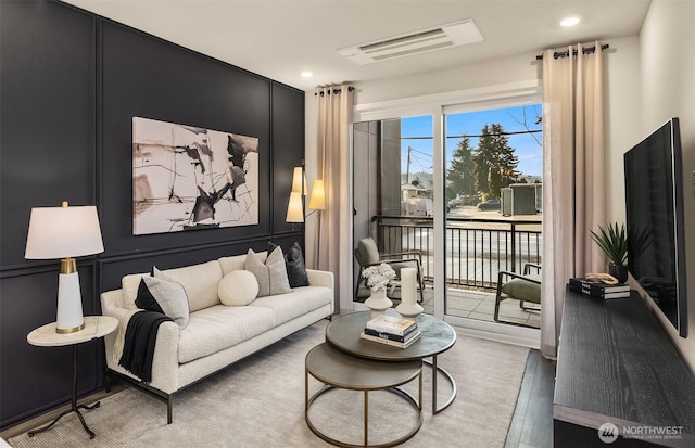 18226 68th Ave NE Unit 505, Kenmore, WA 98028 - living area featuring a decorative wall, visible vents, recessed lighting, and wood finished floors