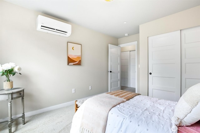 carpeted bedroom with an AC wall unit, baseboards, and a closet