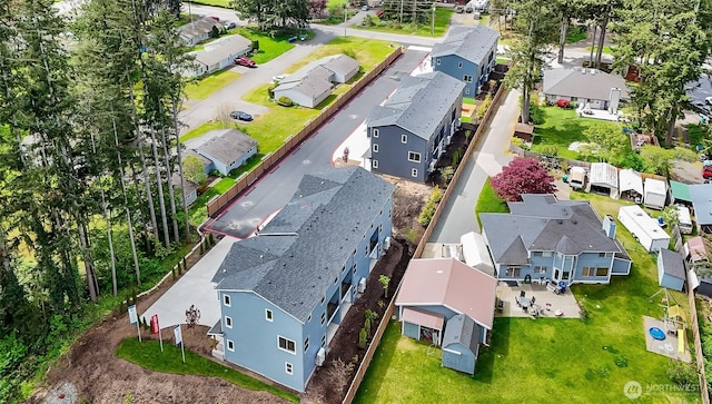birds eye view of property with a residential view