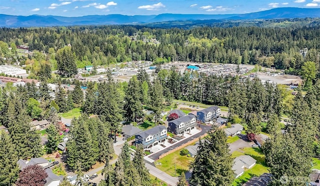 aerial view featuring a mountain view and a forest view