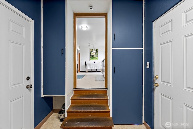 foyer entrance with baseboards