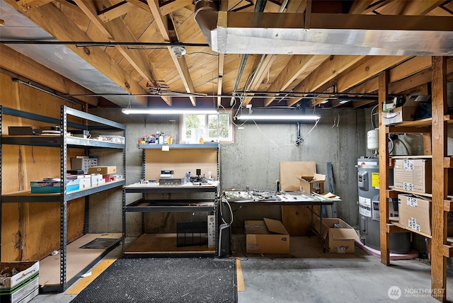 below grade area featuring water heater and a workshop area