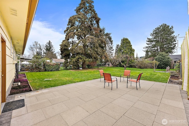 view of patio / terrace with a fenced backyard and visible vents