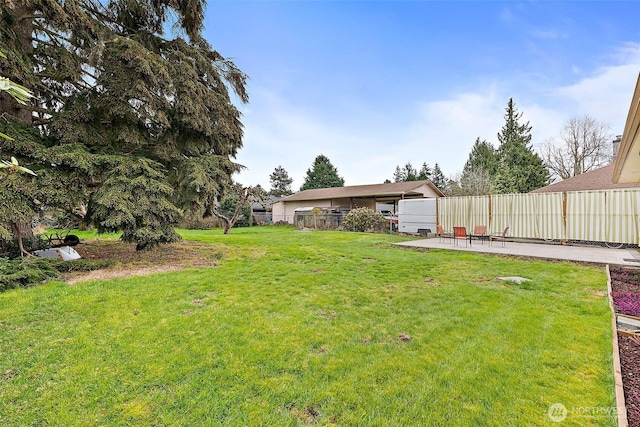 view of yard with a patio and fence