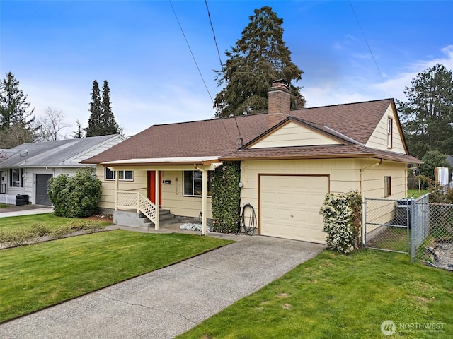 single story home featuring a front yard, fence, a gate, an attached garage, and concrete driveway