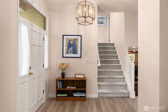 24507 SE 37th St, Sammamish, WA 98029 - foyer entrance featuring wood finished floors, stairway, a chandelier, and baseboards