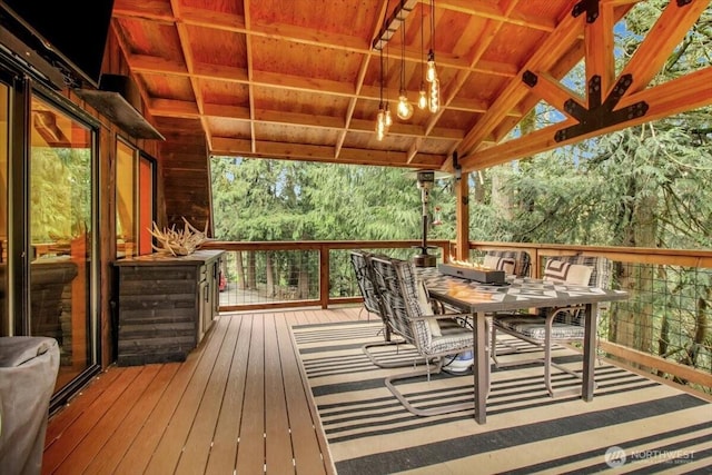 wooden deck with outdoor dining space
