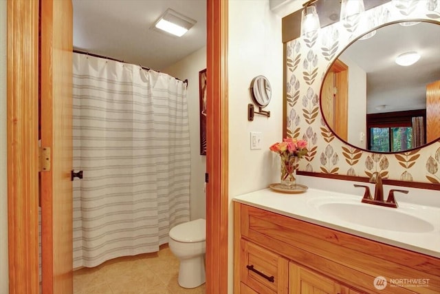 bathroom featuring toilet, tile patterned floors, vanity, and a shower with curtain
