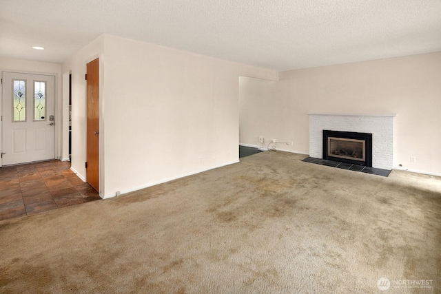 15544 Densmore Ave N, Shoreline, WA 98133 - unfurnished living room with a fireplace, carpet, and a textured ceiling