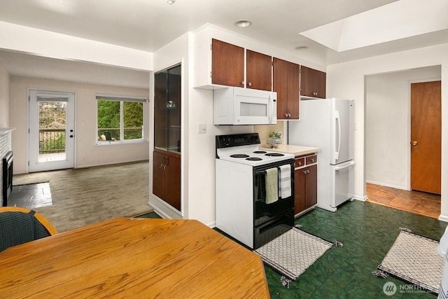 15544 Densmore Ave N, Shoreline, WA 98133 - kitchen with dark brown cabinets, light countertops, white appliances, and baseboards
