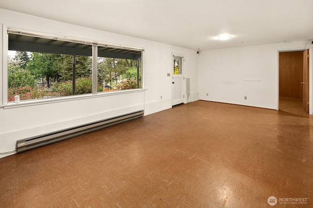 15544 Densmore Ave N, Shoreline, WA 98133 - empty room featuring baseboard heating and tile patterned floors