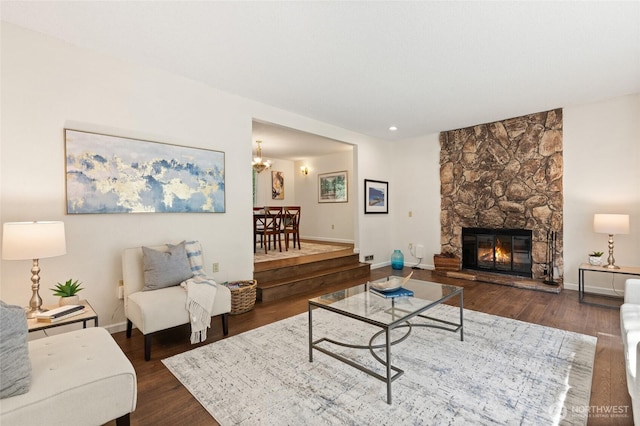 20817 29th Ave SE, Bothell, WA 98021 - living room featuring dark wood-type flooring, a fireplace, baseboards, and a chandelier