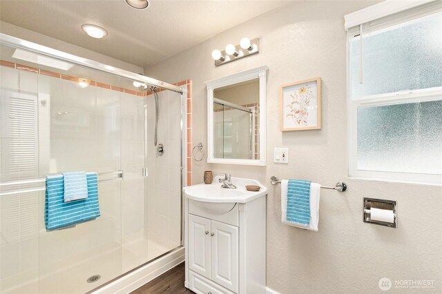 20817 29th Ave SE, Bothell, WA 98021 - full bath with a stall shower, vanity, and wood finished floors