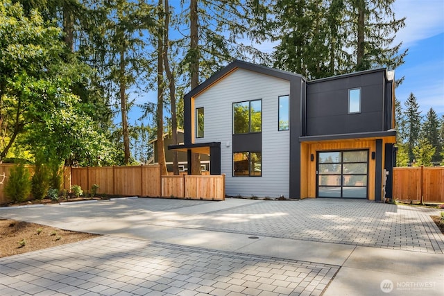 modern home featuring fence
