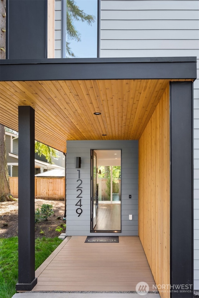doorway to property with fence