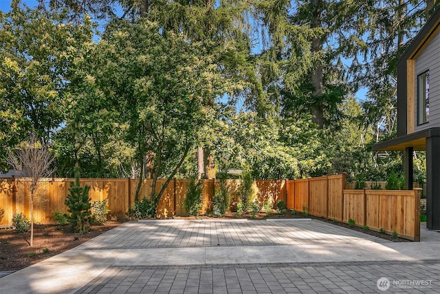 view of patio / terrace featuring fence