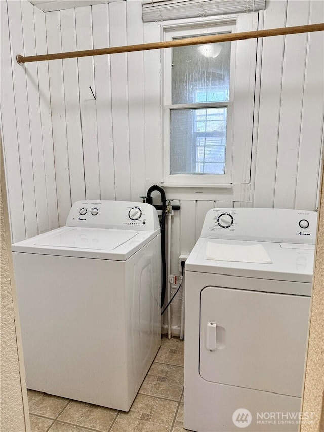 clothes washing area with laundry area and washing machine and clothes dryer