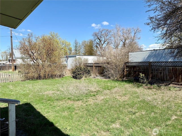 view of yard featuring a fenced backyard