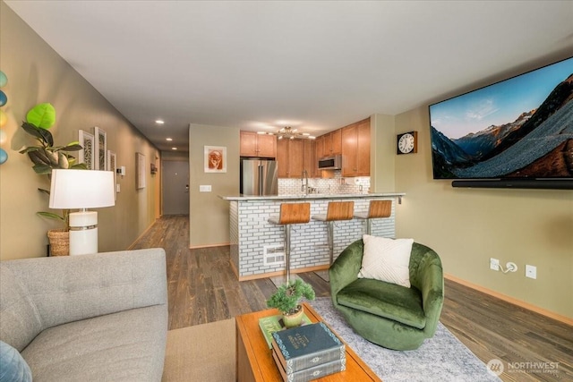 3435 California Ave SW Unit 405, Seattle, WA 98116 - living room featuring recessed lighting, dark wood-style floors, and baseboards