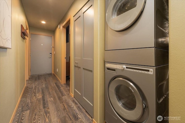 3435 California Ave SW Unit 405, Seattle, WA 98116 - laundry room with baseboards, dark wood-style flooring, laundry area, stacked washer and dryer, and recessed lighting