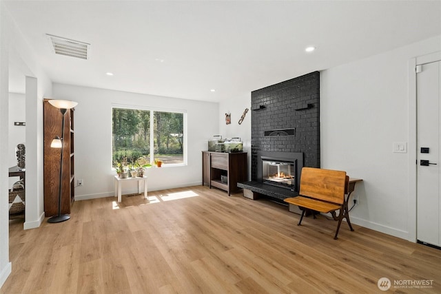 8710 Homestead Ave NE, Olympia, WA 98516 - living room featuring light wood-type flooring, a fireplace, and recessed lighting