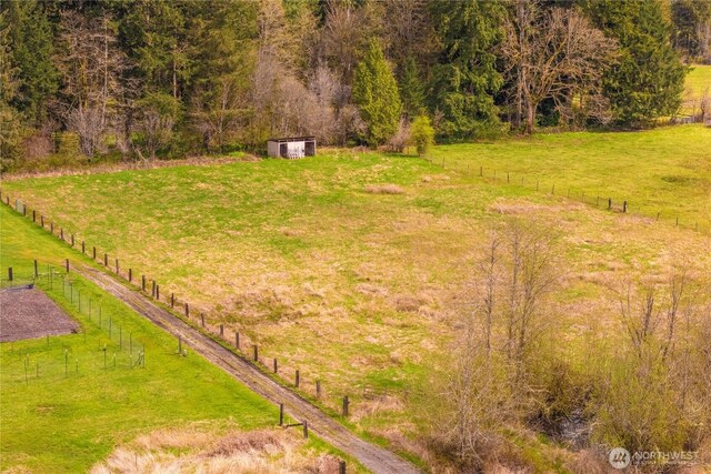 37902 278th Ave SE, Enumclaw, WA 98022 - view of yard with a storage unit, fence, and an outdoor structure