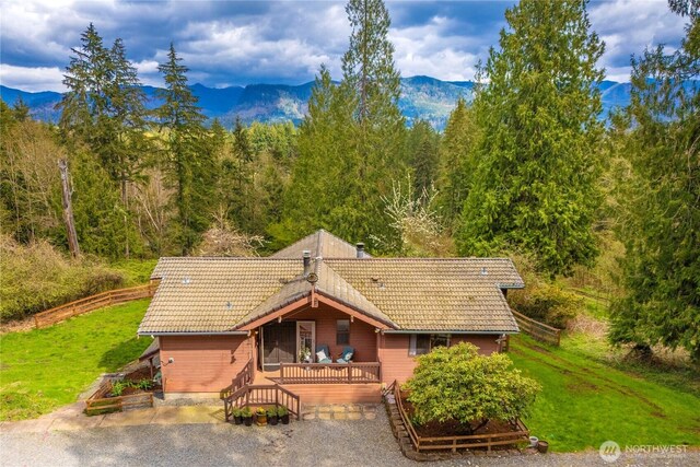 37902 278th Ave SE, Enumclaw, WA 98022 - chalet / cabin with a front lawn, a forest view, a deck with mountain view, and a tile roof