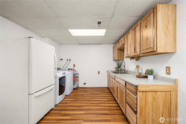 37902 278th Ave SE, Enumclaw, WA 98022 - kitchen with a drop ceiling, wood finished floors, a sink, freestanding refrigerator, and light countertops