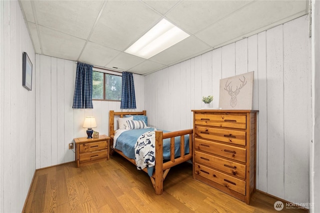 37902 278th Ave SE, Enumclaw, WA 98022 - bedroom featuring a paneled ceiling, wooden walls, and wood finished floors