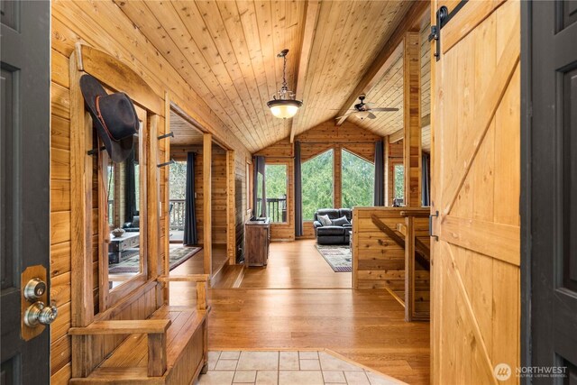 37902 278th Ave SE, Enumclaw, WA 98022 - interior space featuring lofted ceiling with beams, wood walls, wood ceiling, and plenty of natural light