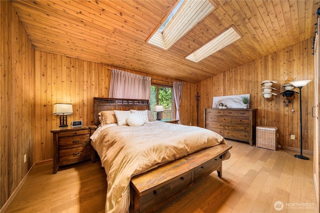 37902 278th Ave SE, Enumclaw, WA 98022 - bedroom with wooden ceiling, wood walls, vaulted ceiling with skylight, and wood finished floors