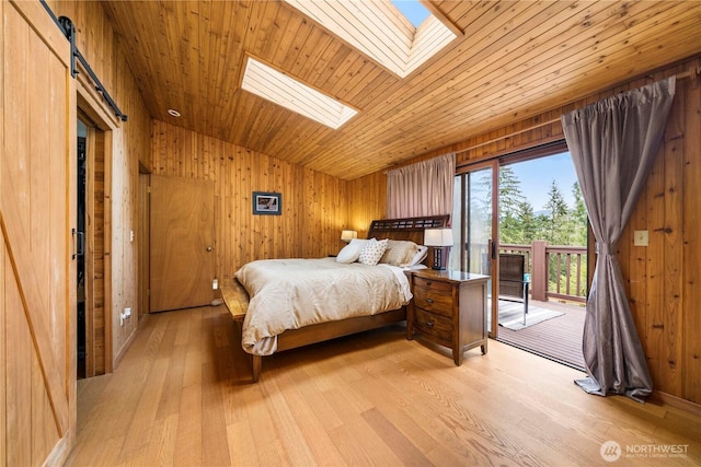 37902 278th Ave SE, Enumclaw, WA 98022 - bedroom with light wood-style flooring, wooden ceiling, wood walls, vaulted ceiling with skylight, and access to exterior