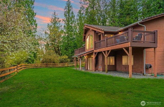 37902 278th Ave SE, Enumclaw, WA 98022 - rear view of house featuring a deck, a lawn, and a fenced backyard