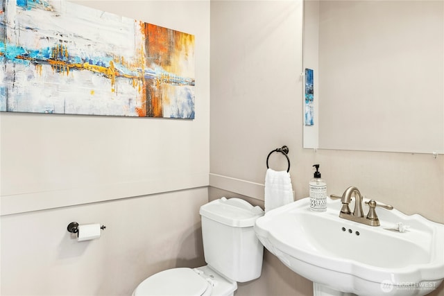 bathroom with a sink and toilet