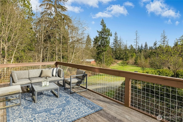 wooden terrace with an outdoor hangout area