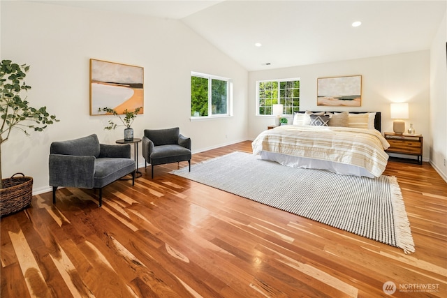 bedroom featuring baseboards, recessed lighting, wood finished floors, and lofted ceiling