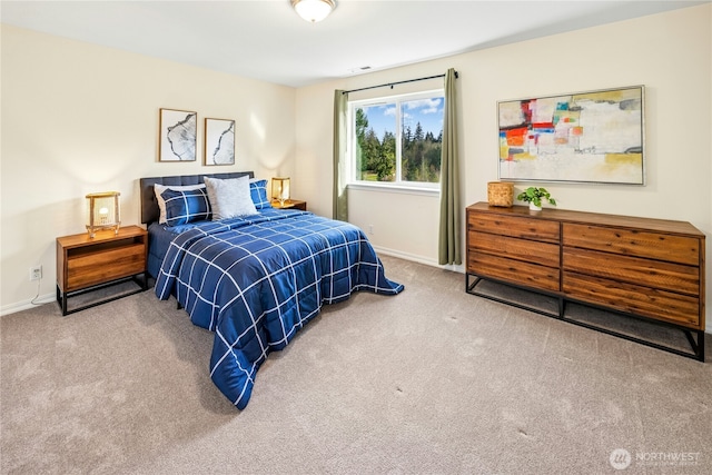 carpeted bedroom featuring visible vents and baseboards