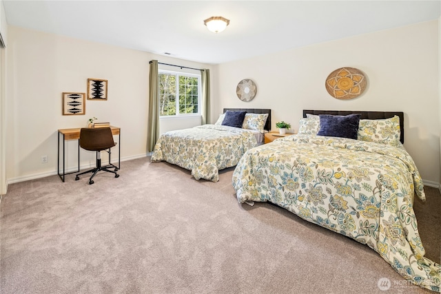 carpeted bedroom with baseboards