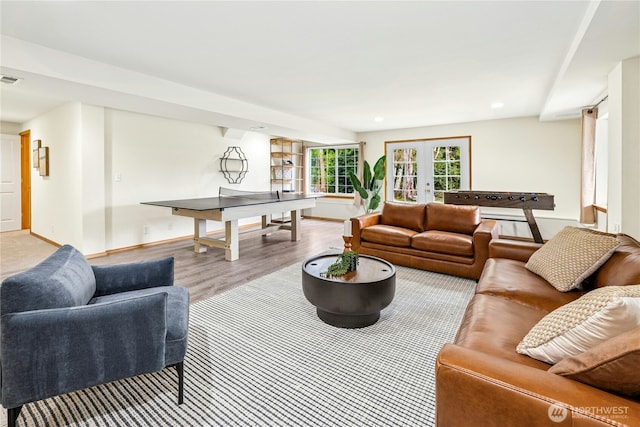 living area with visible vents, recessed lighting, wood finished floors, french doors, and baseboards