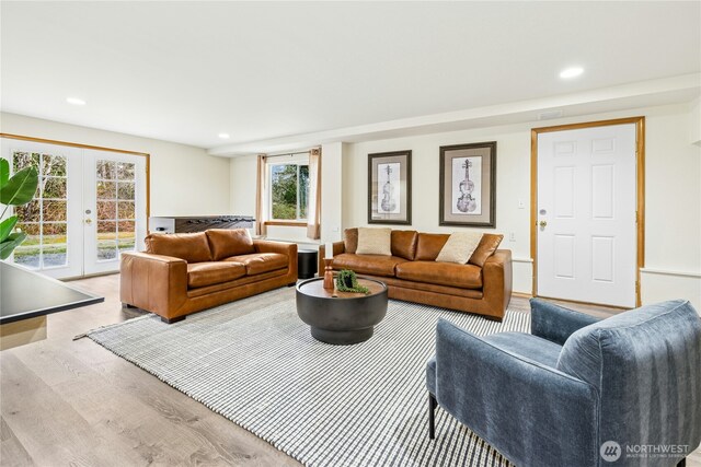 living room with french doors, wood finished floors, and recessed lighting